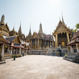 Location Prompt: Grand ancient Thai palace courtyard exterior, bright daytime. Magnificent traditional Thai architecture
